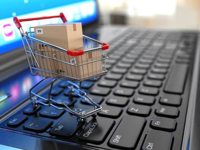 Small business owner packing ecommerce orders for shipping